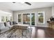 Inviting living room with a cozy seating area, large windows, and access to the outdoor porch at 1625 Banks View Dr, Raleigh, NC 27603