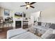 Cozy living room features a fireplace, large sectional sofa, and hardwood floors at 1625 Banks View Dr, Raleigh, NC 27603