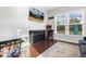 Living room with gaming and entertainment, featuring hardwood floors, natural light and a flat screen television at 1625 Banks View Dr, Raleigh, NC 27603