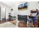 Living room with gaming and entertainment, featuring hardwood floors, natural light and a flat screen television at 1625 Banks View Dr, Raleigh, NC 27603