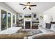 Open-concept living room features a fireplace, hardwood floors and a large window at 1625 Banks View Dr, Raleigh, NC 27603
