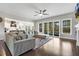 Open concept living room with recessed lights, ceiling fan, hardwood floors and lots of windows at 1625 Banks View Dr, Raleigh, NC 27603