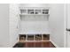 Mudroom features built-in storage with hooks, shelving, and baskets, providing practical organization in a home entryway at 1625 Banks View Dr, Raleigh, NC 27603