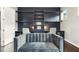 Home office featuring custom shelving and dual workstations, with seating for multiple occupants at 1625 Banks View Dr, Raleigh, NC 27603