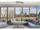 Relaxing screened porch with plush sectional sofa, offering a serene outdoor living space with views of the backyard at 1625 Banks View Dr, Raleigh, NC 27603