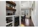 View into the dining room from the hallway with custom wine storage and shelving at 1625 Banks View Dr, Raleigh, NC 27603