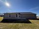 Rear view of house showcasing a patio and yard at 186 Phil Jack Rd, Dunn, NC 28334