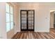 Elegant entryway with glass French doors and wood-look floors at 191 Landon Ridge, Sanford, NC 27330