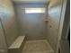 Modern shower with tiled walls and built-in seat at 200 Wild Turkey Way Way, Lillington, NC 27546