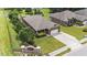 Aerial view of home with a long driveway, well-manicured lawn, and mature trees at 2001 Bunnfield Dr, Zebulon, NC 27597