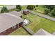 Aerial view of backyard featuring a fenced yard, red shed, and patio area at 2001 Bunnfield Dr, Zebulon, NC 27597