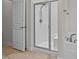 Modern bathroom with a glass-enclosed shower and neutral-toned flooring at 2001 Bunnfield Dr, Zebulon, NC 27597