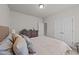 Cozy bedroom featuring comfortable bed, dresser and ensuite bathroom at 2001 Bunnfield Dr, Zebulon, NC 27597