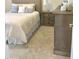 Bedroom with plush bedding and wooden dresser at 2001 Bunnfield Dr, Zebulon, NC 27597