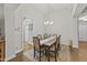 Elegant dining room features a large table with seating for six and plenty of natural light at 2001 Bunnfield Dr, Zebulon, NC 27597