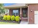 Inviting brick home showcasing the front porch with tidy landscaping, perfect for curb appeal at 2001 Bunnfield Dr, Zebulon, NC 27597