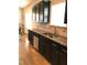 Modern kitchen with dark cabinetry and granite countertops at 2001 Bunnfield Dr, Zebulon, NC 27597