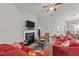 Spacious living room featuring a fireplace, comfortable seating, and vaulted ceilings at 2001 Bunnfield Dr, Zebulon, NC 27597