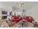 Open-concept living room features comfortable seating, a fireplace, and an open view to the dining area at 2001 Bunnfield Dr, Zebulon, NC 27597