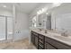 Well-lit bathroom featuring double vanity, soaking tub and glass enclosed shower at 2001 Bunnfield Dr, Zebulon, NC 27597