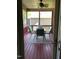 Relaxing screened porch with table and chairs at 2001 Bunnfield Dr, Zebulon, NC 27597