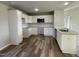 Modern kitchen with white cabinets and granite countertops at 202 Pate Landing Dr, Selma, NC 27576