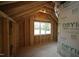 Unfinished bedroom with window and exposed framing at 211 W Harnett St, Dunn, NC 28334