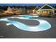 Expansive community pool with a unique design, featuring a central walkway, lounge chairs, and clubhouse nearby at 227 Augusta Pond Way # 159, Raleigh, NC 27603