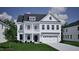 Two-story home with white siding, and a two-car garage at 227 Augusta Pond Way # 159, Raleigh, NC 27603
