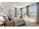 Bedroom with large windows and neutral decor at 2328 Sugar Cone Way, Fuquay Varina, NC 27526
