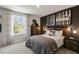 Stylish bedroom with dark accent wall and guitar at 2328 Sugar Cone Way, Fuquay Varina, NC 27526