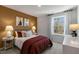 Bright bedroom with double bed, side tables, and window at 2328 Sugar Cone Way, Fuquay Varina, NC 27526