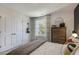 Bedroom with large window and dresser at 2328 Sugar Cone Way, Fuquay Varina, NC 27526