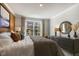 Bright bedroom with large bed and plenty of light at 2328 Sugar Cone Way, Fuquay Varina, NC 27526