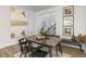 Dining area with wood table, chairs, and bench seating at 2328 Sugar Cone Way, Fuquay Varina, NC 27526
