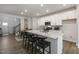 Modern kitchen with white cabinets, quartz countertops and island at 2328 Sugar Cone Way, Fuquay Varina, NC 27526