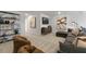 Open loft with sectional sofa and built-in shelving at 2328 Sugar Cone Way, Fuquay Varina, NC 27526