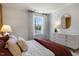 Bedroom with a maroon comforter and white dresser at 2334 Sugar Cone Way, Fuquay Varina, NC 27526