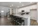 Modern kitchen with white cabinets, quartz countertops, and island at 2334 Sugar Cone Way, Fuquay Varina, NC 27526