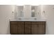 Double vanity bathroom with modern cabinets and a large mirror at 317 Umstead St, Sanford, NC 27330