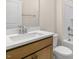 Clean bathroom with quartz countertop and wood vanity at 317 Umstead St, Sanford, NC 27330
