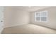 Bright bedroom with neutral walls and carpet at 317 Umstead St, Sanford, NC 27330