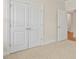 Spacious bedroom with double doors and carpet flooring at 317 Umstead St, Sanford, NC 27330