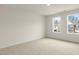 Bedroom with two windows and carpet at 317 Umstead St, Sanford, NC 27330