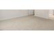 Simple bedroom with neutral carpeting and an adjacent door at 317 Umstead St, Sanford, NC 27330