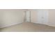 Spacious bedroom with double doors and carpet at 317 Umstead St, Sanford, NC 27330