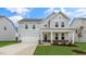 Two story home with gray siding and a welcoming front porch at 317 Umstead St, Sanford, NC 27330