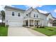 Two story home with gray siding and a welcoming front porch at 317 Umstead St, Sanford, NC 27330