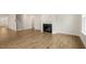 Living room with hardwood floors and a fireplace at 317 Umstead St, Sanford, NC 27330