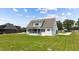 Spacious backyard featuring a screened porch, providing ample space for outdoor activities and enjoyment at 321 Bud Wall Rd, Youngsville, NC 27596